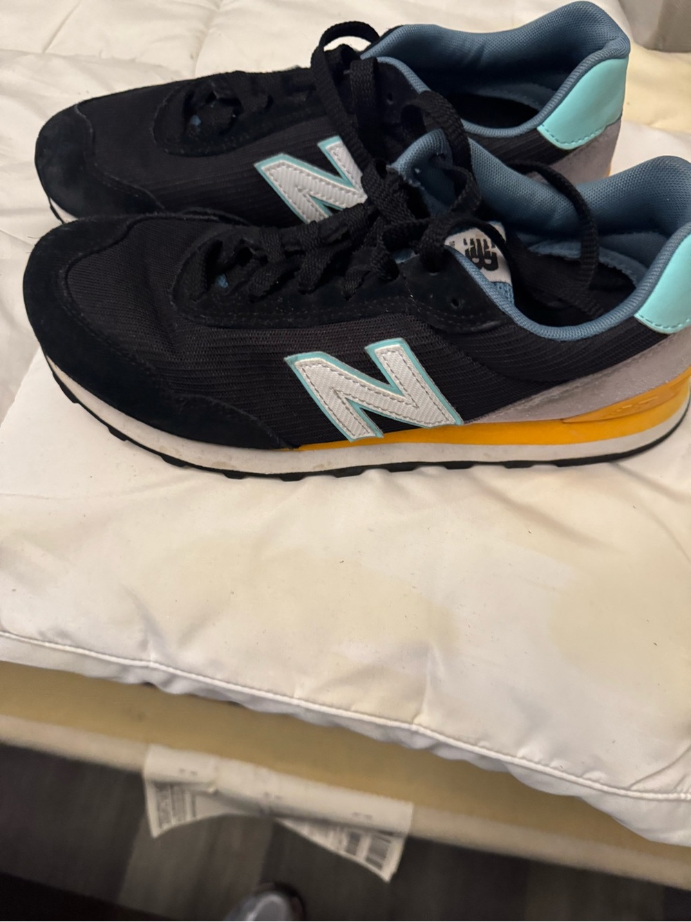 New Balance woman’s Black, Aqua & Yellow Runner Sneakers